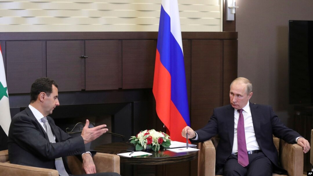 Tổng thống Nga Vladimir Putin (phải) và TT Syria Bashar al-Assad.