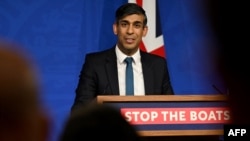 Britain's Prime Minister Rishi Sunak reacts as he gives a press conference, following the Supreme Court's Rwanda policy judgement, at Downing Street, in central London, November 15, 2023.