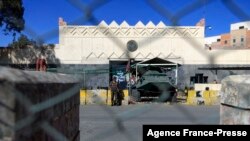 FILE - A security guard is seen posted at the closed U.S. Embassy compound in Yemen's capital Sanaa, Jan. 18, 2021. 