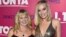 Tonya Harding, left, and Margot Robbie arrive at the Los Angeles premiere of "I, Tonya" at the Egyptian Theatre on Tuesday, Dec. 5, 2017. (Photo by Jordan Strauss/Invision/AP)