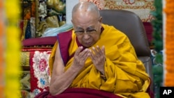 FILE - Tibetan spiritual leader the Dalai Lama presides over a prayer session where a group of Indian devotees prayed for his longevity in Dharamshala, India, Dec. 6, 2024. 