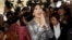 Thailand's former Prime Minister Yingluck Shinawatra, center, leaves parliament in Bangkok, Jan. 22, 2015.