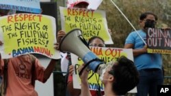 FILE - A protester shouts slogans during a rally outside the Chinese consulate in Metro Manila, Philippines on May 7, 2021. 