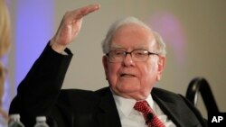 FILE - Investor Warren Buffett talks with CNBC's Becky Quick at PurposeBuilt2017, a national conference sponsored by the Purpose Built Communities group that Buffett supports, in Omaha, Neb., Oct. 3, 2017. Buffett discussed what philanthropy can do to help fight poverty.