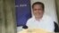 ផ្ទាំង​រូបថត​​លោក ​កែម ឡី ដែលដាក់​តម្កល់​អមផ្នូររបស់​លោក​នៅ​ឃុំលាយបូរ ស្រុក​ត្រាំកក់​ ខេត្តតាកែវ​ ថ្ងៃទី​២០ ខែមិថុនា​ ឆ្នាំ​២០២០។ (ហ៊ុល រស្មី​/វីអូអេ)​​