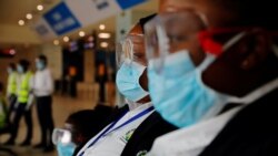 FILE PHOTO: Health workers waits to screen travellers for signs of the coronavirus at the Kotoka International Airport in Accra, Ghana January 30, 2020. REUTERS/Francis Kokoroko/File Photo