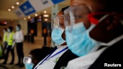 Health workers waits to screen travellers for signs of the coronavirus at the Kotoka International Airport in Accra, Ghana January 30, 2020.