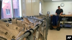 In this Oct. 4, 2018 photo, Pennsylvania Corrections Department mail inspector Brian Strawser sorts inmate mail at the state prison in Camp Hill, Pa.