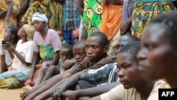 A group of Burundian refugees wait for a soap and blanket distribution at Gashora on Bugesera, Rwanda, April 10, 2015.