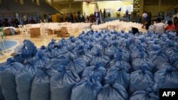 Sacks containing relief food packs to be distributed to typhoon-affected residents are seen at a hall as Super Typhoon Mangkhut approaches the city of Tuguegarao, Cagayan province, north of Manila on Sept. 14, 2018. 