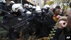 Skirmishes between Serbian police and opposition protesters demanding arrests over a deadly roof collapse at a railway station in Novi Sad, Serbia, Nov. 20, 2024.