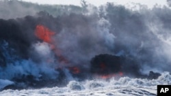 Lava flows into the ocean near Pahoa, Hawaii, May 20, 2018. 