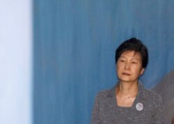 FILE - Former South Korean President Park Geun-hye arrives at a court in Seoul, South Korea, Aug. 25, 2017.