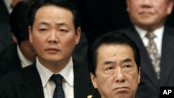 Japan's Prime Minister Kan attends a rally to call on Russia to return a group of islands, in Tokyo, February 7, 2011