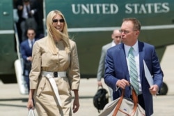White House senior adviser Ivanka Trump and Acting White House Chief of Staff Mick Mulvaney walk from the Marine One helicopter as they depart Washington for travel to the G-20 summit from Joint Base Andrews, Maryland, June 26, 2019.