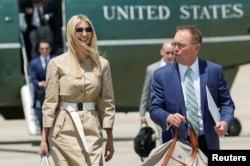 White House senior adviser Ivanka Trump and Acting White House Chief of Staff Mick Mulvaney walk from the Marine One helicopter as they depart Washington for travel to the G-20 summit from Joint Base Andrews, Maryland, June 26, 2019.