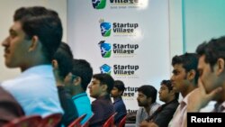 FILE - Entrepreneurs, employees and students listen to a speech during the Start-up saturday event at the Start-up Village in Kinfra High Tech Park in the southern Indian city of Kochi, Oct. 13, 2012. 