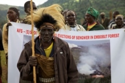 FILE - People from the Sengwer community protest their eviction from their ancestral lands, Embobut Forest, by the government for forest conservation in western Kenya, April 19, 2016.