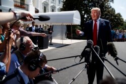 FILE - President Donald Trump talks to reporters on the South Lawn of the White House before departing for his Bedminster, N.J. golf club, July 5, 2019.