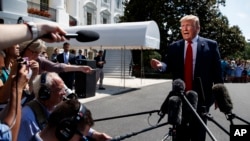 President Donald Trump talks to reporters on the South Lawn of the White House before departing for his Bedminster, N.J. golf club, July 5, 2019.