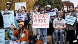 FILE - Activists demonstrate as the Supreme Court hears oral arguments on a pair of cases that could decide the future of affirmative action in college admissions, in Washington, Oct. 31, 2022. (AP Photo/J. Scott Applewhite, File)