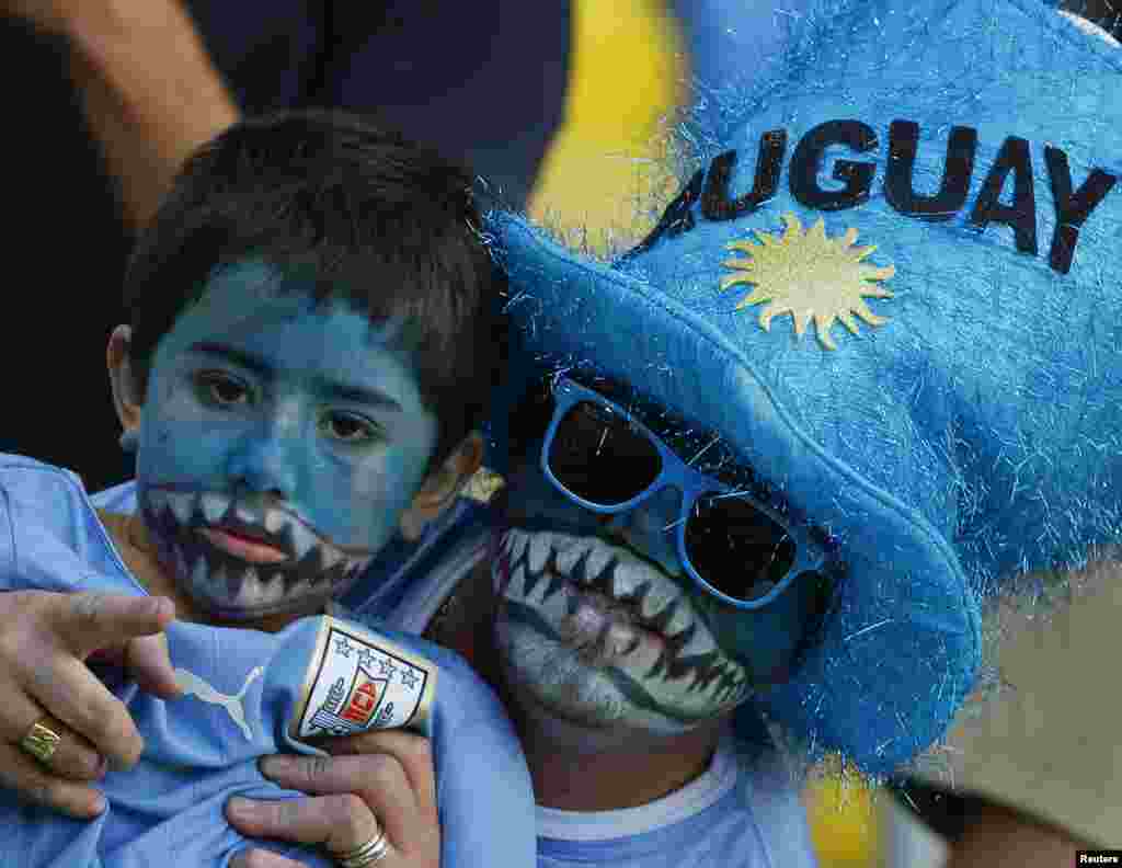 Uruguay fans bare their teeth before the game against Colombia at the Maracana stadium in Rio de Janeiro, June 28, 2014. 