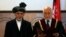 Afghanistan's new President Ashraf Ghani Ahmadzai (L) stands next to Afghanistan's Chief Justice Abdul Salam Azimi as he takes the oath during his inauguration as president in Kabul, September 29, 2014.