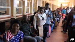 Zambia Elections: Zambians queue to cast their votes at a polling station in Lusaka, Thursday, Aug. 11, 2016 in a tight election race for president and parliament that has been marred by violence between rival factions. 