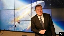 FILE - In this Jan. 19, 2020, file photo Elon Musk, founder, CEO, and chief engineer/designer of SpaceX speaks during a news conference at the Kennedy Space Center in Cape Canaveral, Fla. The meteoric rise of Tesla shares that pushed the company's…