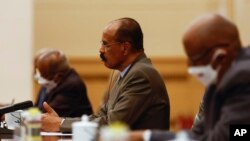 FILE - Eritrean President Isaias Afwerki, center, attends a meeting with Chinese Premier Li Qiang, not pictured, at the Great Hall of the People, in Beijing Monday, May 15, 2023. 