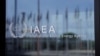 FILE - The logo of the International Atomic Energy Agency is seen at its headquarters in Vienna, Austria, April 11, 2024. Two IAEA reports on Feb. 26, 2025, warned that Iran's stock of near-weapons-grade uranium has increased by half.