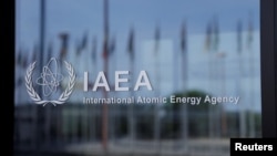 FILE - The logo of the International Atomic Energy Agency is seen at its headquarters in Vienna, Austria, April 11, 2024. Two IAEA reports on Feb. 26, 2025, warned that Iran's stock of near-weapons-grade uranium has increased by half.