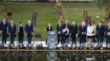 Speakers, including former President Bill Clinton, fourth from left, stand at the opening of ceremonies to commemorate the 20th anniversary of the Oklahoma City bombing, at the Oklahoma City National Memorial, in Oklahoma City, Sunday, April 19, 2015.