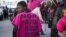 FILE - A woman wears a jersey reading "No to female genital mutilation" during a demonstration in Marseille, southern France, March 8, 2018.