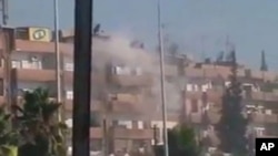 August 3 image from mobile video shows smoke rising from a building in the Al Hader area of Hama (third party image; content cannot be independently confirmed by Reuters)