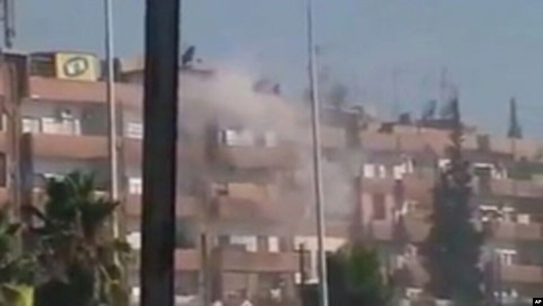 August 3 image from mobile video shows smoke rising from a building in the Al Hader area of Hama (third party image; content cannot be independently confirmed by Reuters)