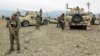 FILE - Afghan National Army troops prepare for an operation against insurgents in Khogyani district of Nangarhar province, Afghanistan, Nov. 28, 2017. 