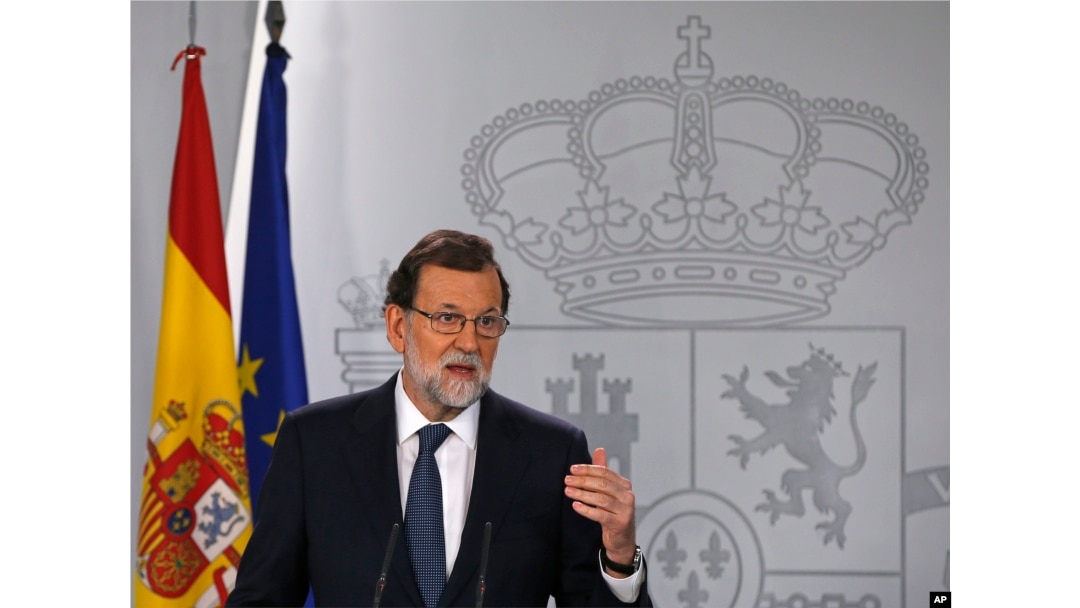 Spain's Prime Minister Mariano Rajoy gestures as he delivers a statement at the Moncloa Palace in Madrid, Oct. 11, 2017.
