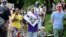 Katrina Hendricks, left, pushes a stroller holding her son, Melo, as her mother, Elaine Loving, walks alongside her at a Juneteenth rally and march through a historically Black neighborhood in Portland, Ore, June 19, 2020. 