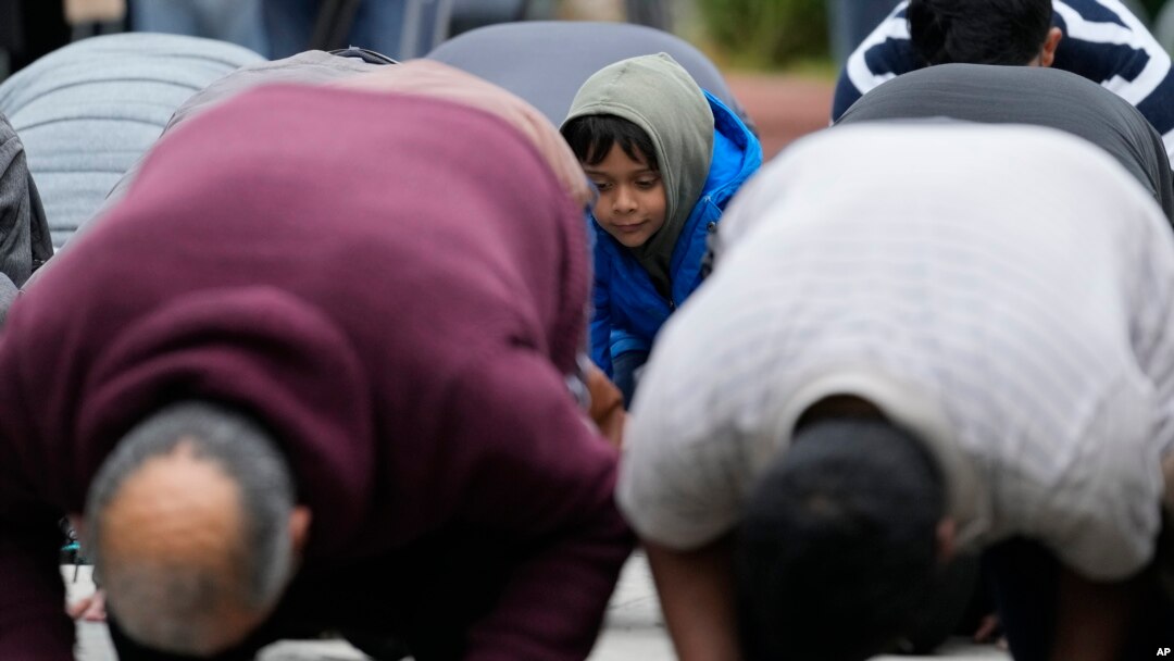 FILE - Muslim community members pray for Wadea Al Fayoume at Mosque Foundation in Bridgeview, Ill., Oct. 16, 2023.