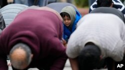 FILE - Muslim community members pray for Wadea Al Fayoume at Mosque Foundation in Bridgeview, Ill., Oct. 16, 2023.