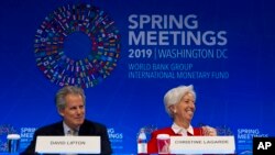 International Monetary Fund (IMF) Managing Director Christine Lagarde accompanied by Deputy Managing Director David Lipton, speak at a news conference, during the World Bank/IMF Spring Meetings in Washington, April 11, 2019.
