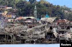 ຊາກຕຶກຫັກພັງໃນເມືອງສົງຄາມ Marawi City, ພາກໃຕ້ຂອງຟິລິບປີນ ຫຼັງຈາກທີ່ ທາງຟິລິບປີນໄດ້ປະກາດ ໃນວັນຈັນຜ່ານມາ ເຖິງການປະຕິບັດງານທາງທະຫານ ມາເປັນເວລາ 5 ເດືອນ ໄດ້ຈົບລົງ ໃນເມືອງທາງພາກໃຕ້ຂອງປະເທດ ຊຶ່ງເປັນຂົງເຂດທີ່ນິຍົມອິສລາມ, 24 ຕຸລາ, 2017..