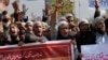 FILE - Pakistani students of Islamic seminaries chant slogans during a rally in support of blasphemy laws, in Islamabad, Pakistan, March 8, 2017.