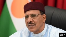 (FILES) Niger's President Mohamed Bazoum attends a meeting with United Nations (UN) Secretary-General Antonio Guterres (not seen) at the presidential palace in Niamey on May 2, 2022.