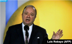 FILE - Colombian Minister of Defense Luis Carlos Villegas speaks at a press conference in Bogota, Sept. 5, 2017.