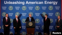 U.S. President Donald Trump participates in a discussion on energy with Energy Secretary Rick Perry (2nd-R), EPA Administrator Scott Pruitt (R), Interior Secretary Ryan Zinke (L) and Vice President Mike Pence (2nd-L), at the Department of Energy in Washin