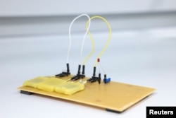 Rechargeable edible batteries made from food are displayed at Istituto Italiano di Tecnologia in Milan