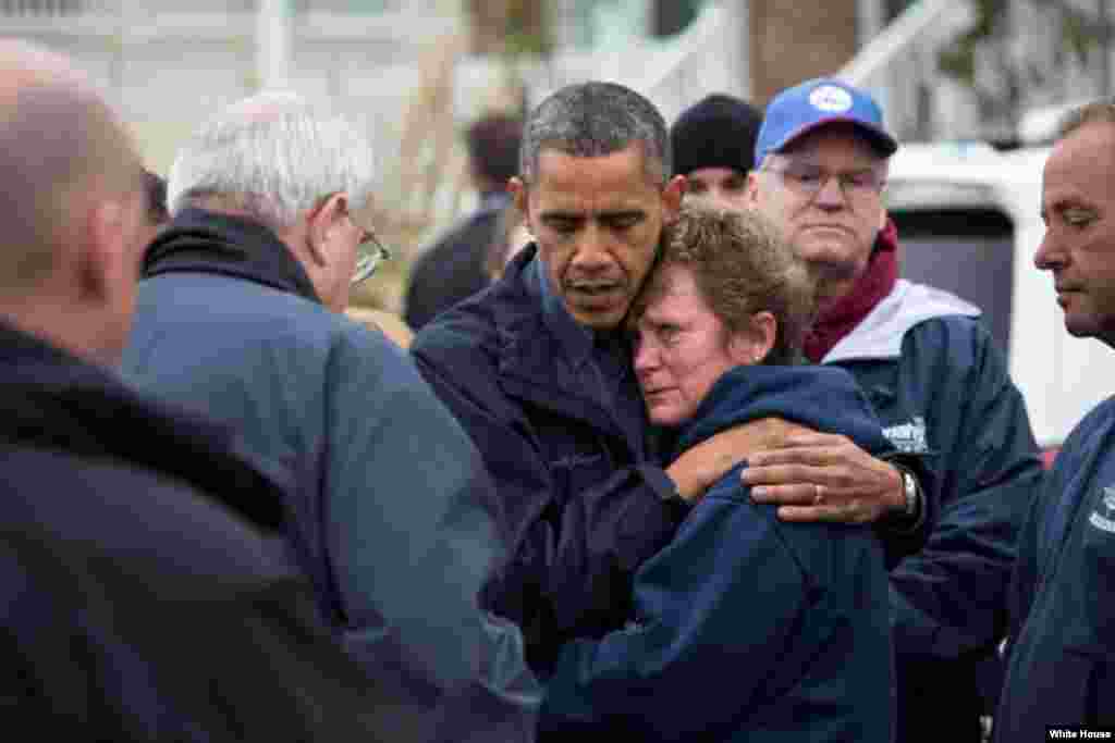 President Barack Obama hugs Donna Vanzant, the owner of North Point Marina, as he tours damage from Hurricane Sandy in Brigantine, N.J., Oct. 31, 2012. (White House/Pete Souza)
