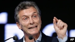 FILE - Argentina's President Mauricio Macri speaks during a meeting with the Argentine Industrial Union in Buenos Aires, Argentina, Dec. 14, 2015. 